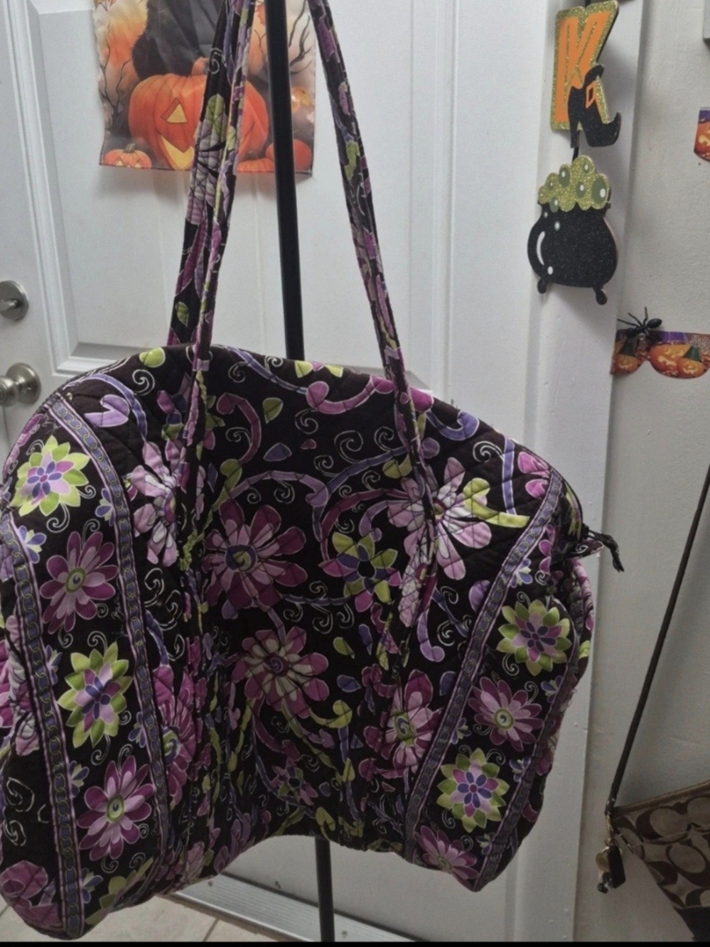 Large quilted duffel bag by Vera Bradley featuring their floral "Purple Punch"